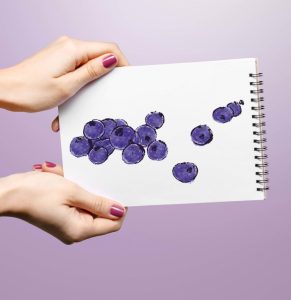 Woman Hand Holding Blank Spiral Notepad.
